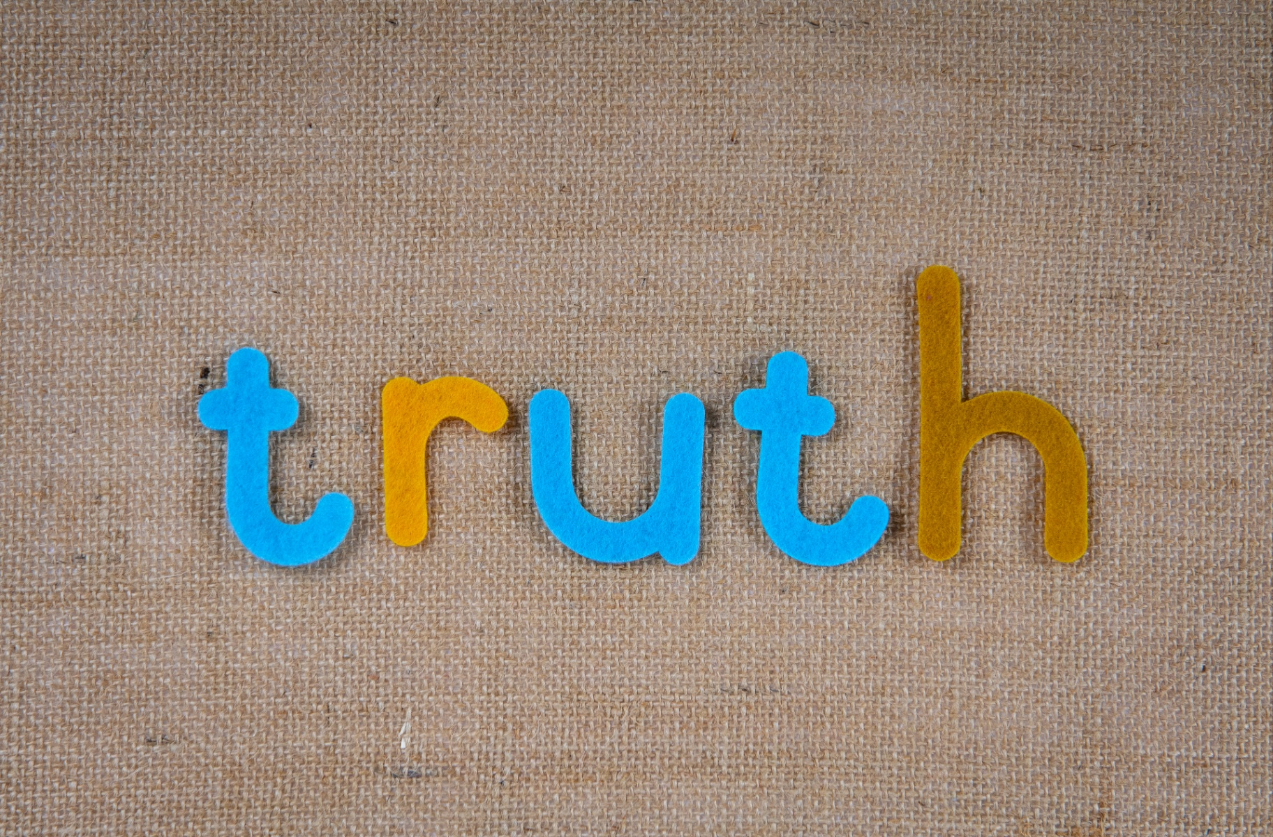 the word truth in colored letters